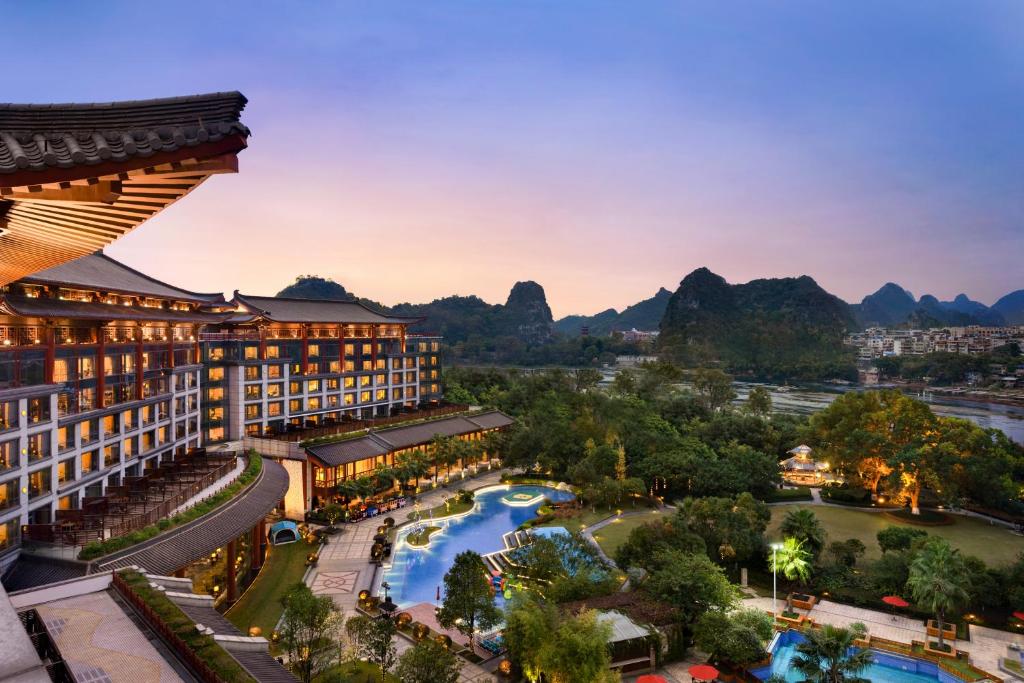 an aerial view of the resort with mountains in the background at Shangri-La Guilin in Guilin