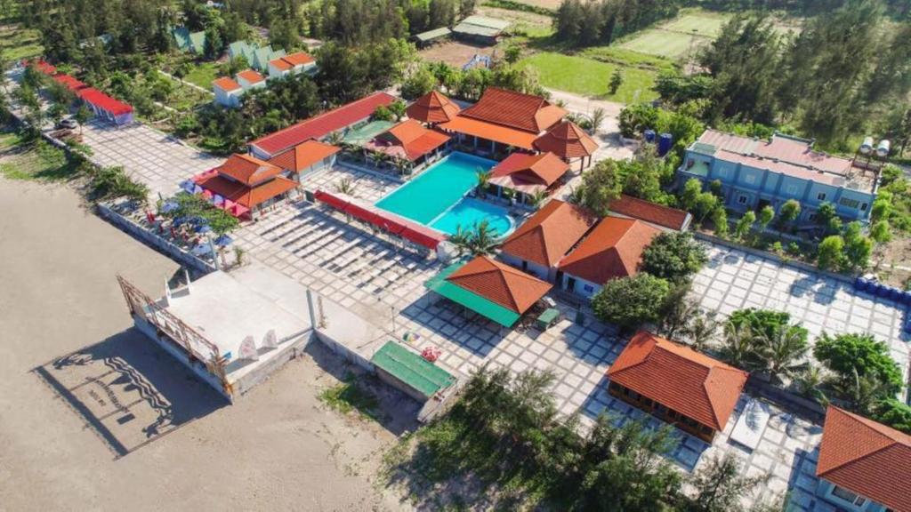 an overhead view of a house with a swimming pool at Ruby Star Quỳnh Resort 