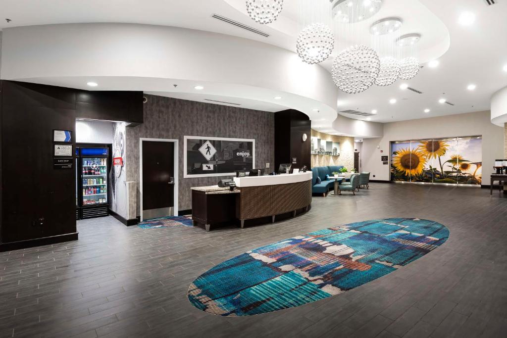 a lobby with a waiting area and a waiting room at Hampton Inn & Suites - Raleigh Downtown in Raleigh