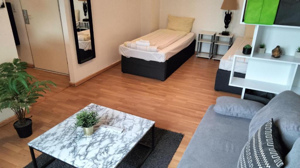 Postel nebo postele na pokoji v ubytování Praktische City Apartments direkt am Hauptbahnhof