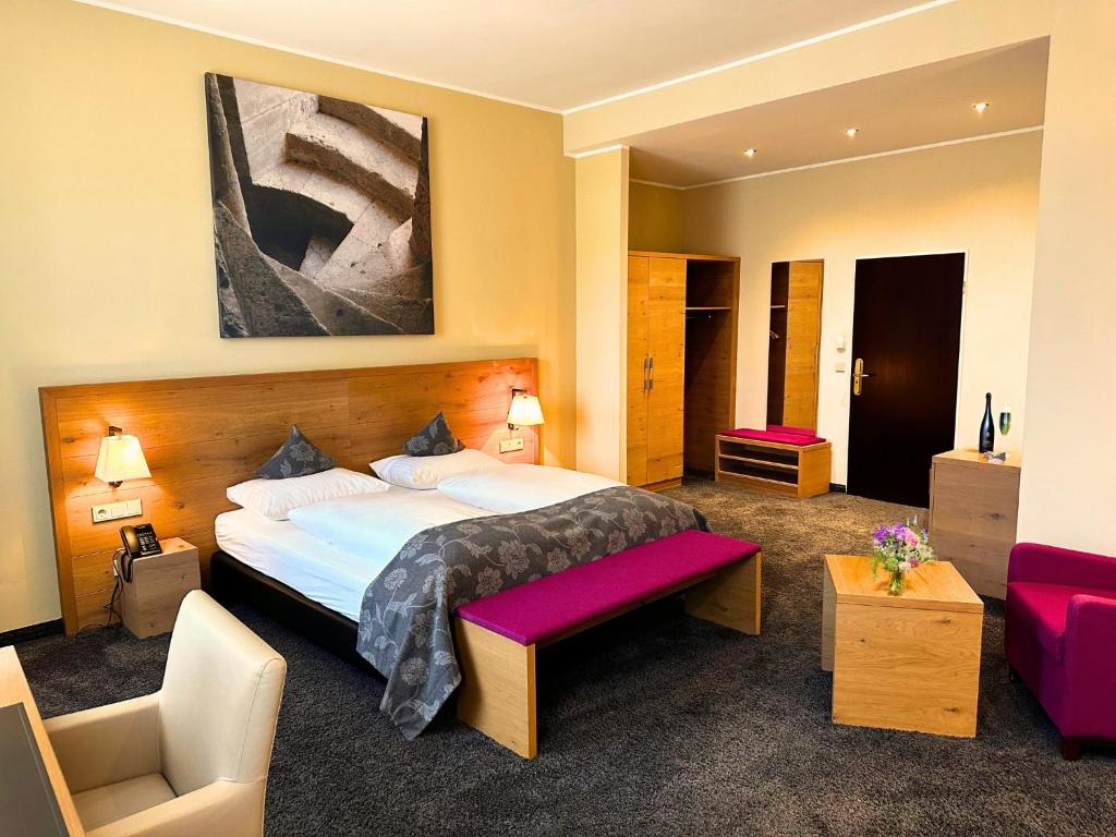 Postel nebo postele na pokoji v ubytování Augustiner Hotel