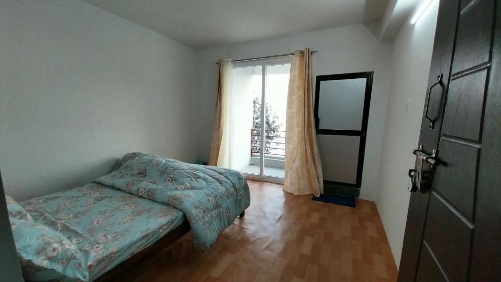 Postel nebo postele na pokoji v ubytování Dumfu Homestay