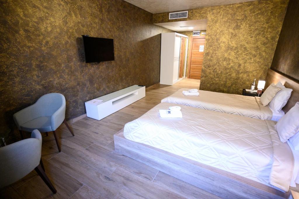 Postel nebo postele na pokoji v ubytování Monogramlux