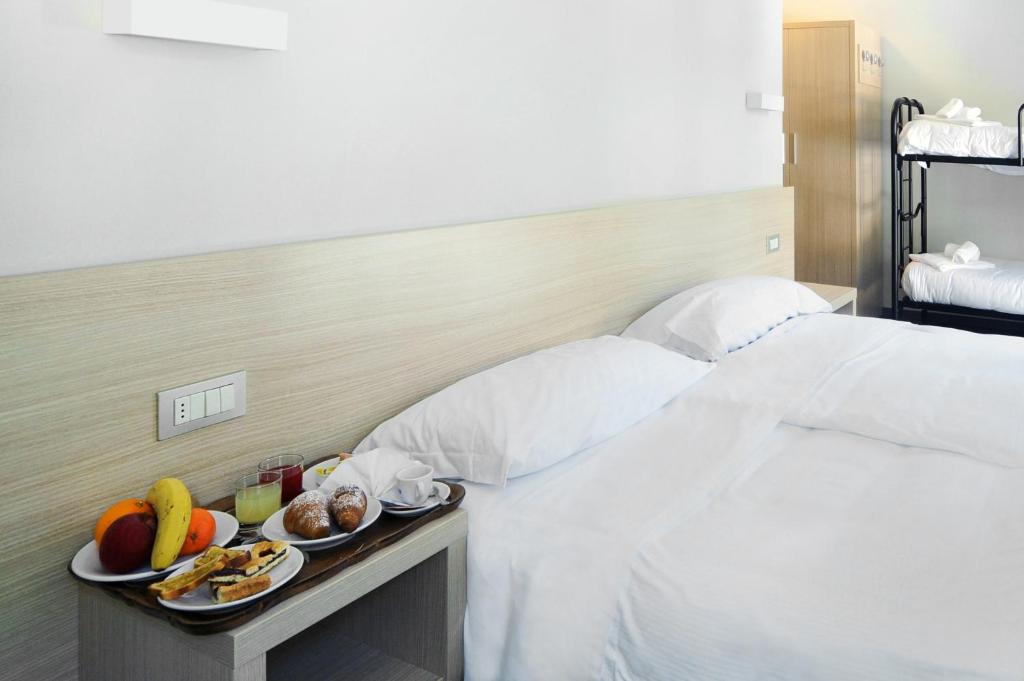 Postel nebo postele na pokoji v ubytování Hotel Croda Rossa