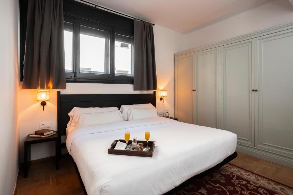 Postel nebo postele na pokoji v ubytování Angelats Hotel - A Signature Boutique Hotel & Restaurant