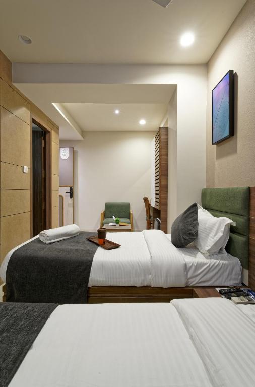 Postel nebo postele na pokoji v ubytování Exora Inn