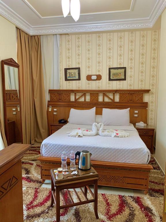 Postel nebo postele na pokoji v ubytování Teba Hotel Ras Elbar
