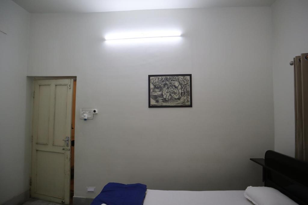 Postel nebo postele na pokoji v ubytování SWET APARAJITA