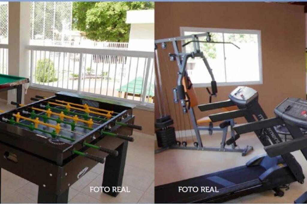a gym with a pool table and a treadmill at Apartamento Confortável. Auxílio/dicas na cidade. in Juazeiro do Norte