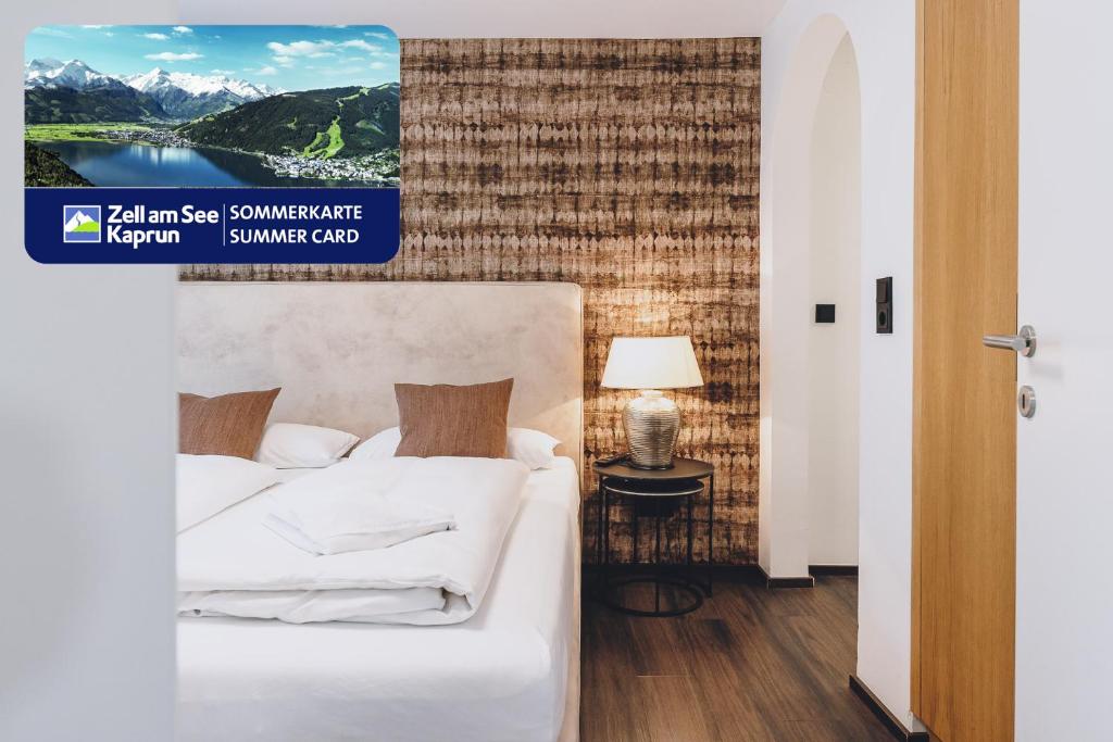 Łóżko lub łóżka w pokoju w obiekcie Alpine City Living by we rent, SUMMERCARD INCLUDED