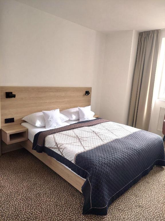 Postel nebo postele na pokoji v ubytování Hotel Avion