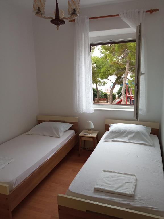 Postel nebo postele na pokoji v ubytování Guesthouse Dante