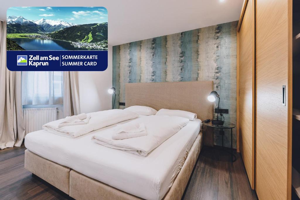 Łóżko lub łóżka w pokoju w obiekcie Alpine City Living by we rent, SUMMERCARD INCLUDED