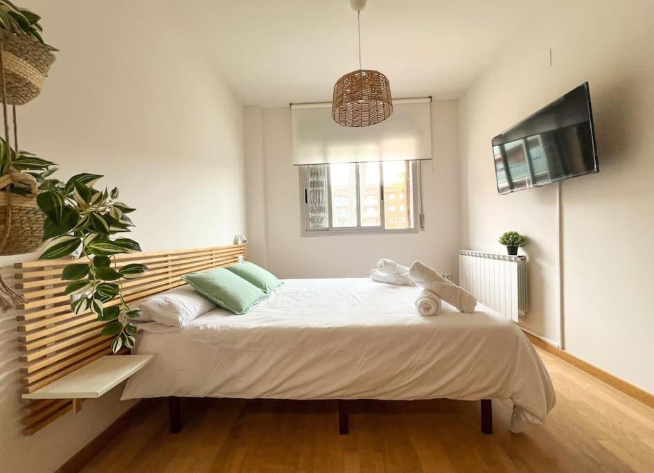 a bedroom with a large bed in a room at Apartamento La Sal Cubelles in Cubelles