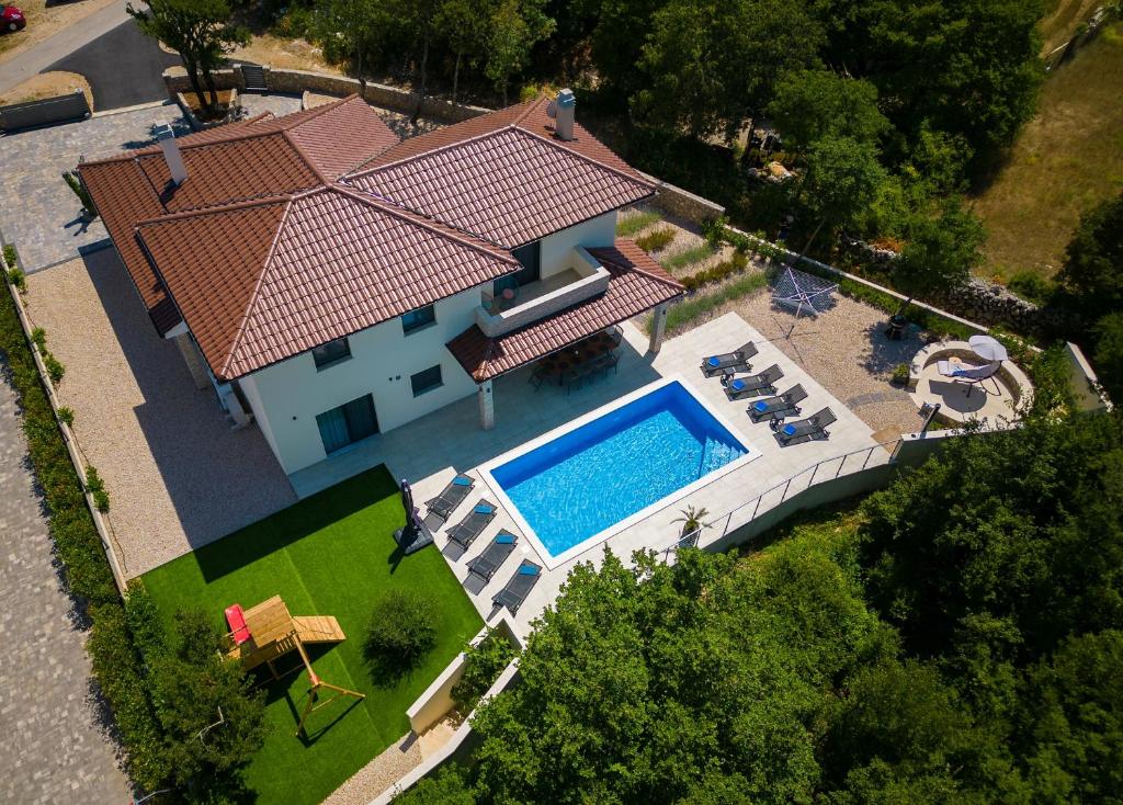 an overhead view of a house with a swimming pool at Villa Andante in Krk