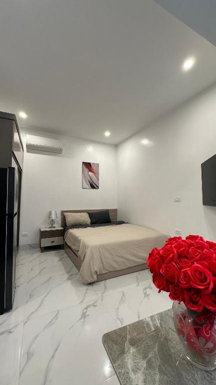 Postel nebo postele na pokoji v ubytování Giảm Giá 25 Phần Trăm- Homestay - Kim Mã - Giang Văn Minh