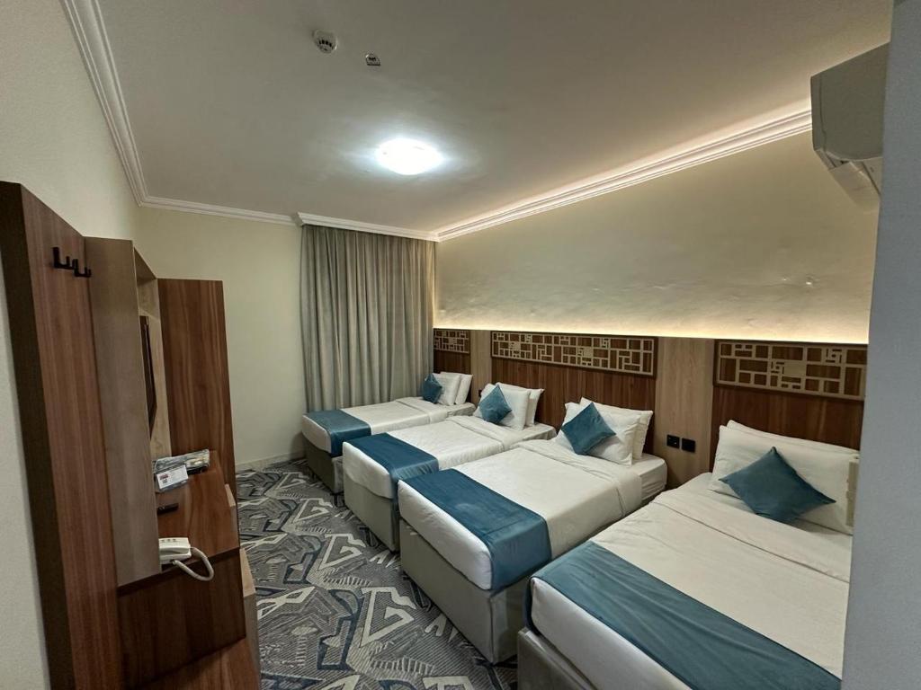 Postel nebo postele na pokoji v ubytování فندق اسكنت العزيزيه - Askant Al Azizyia Hotel