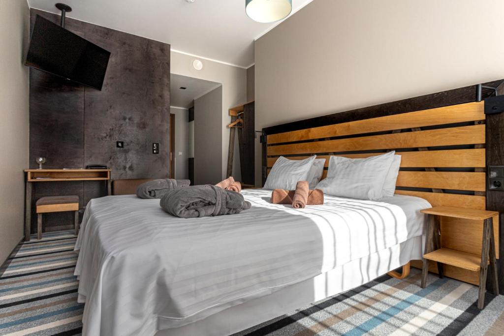 Postel nebo postele na pokoji v ubytování Johan Design & SPA Hotel
