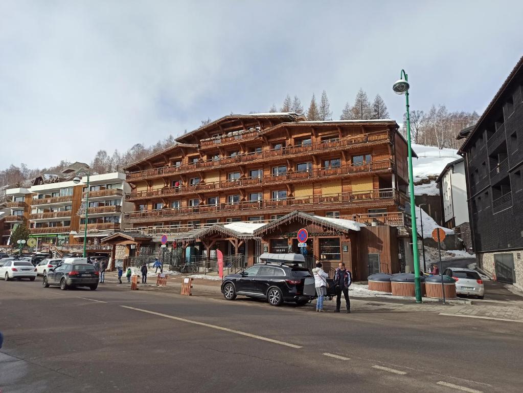 a large building on the side of a street at Label OR appartement spacieux proximité pistes in Les Deux Alpes