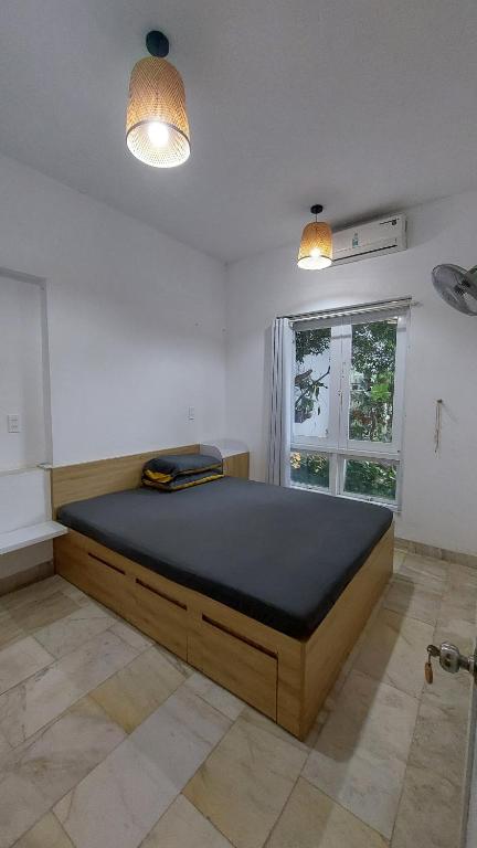 Postel nebo postele na pokoji v ubytování NT House