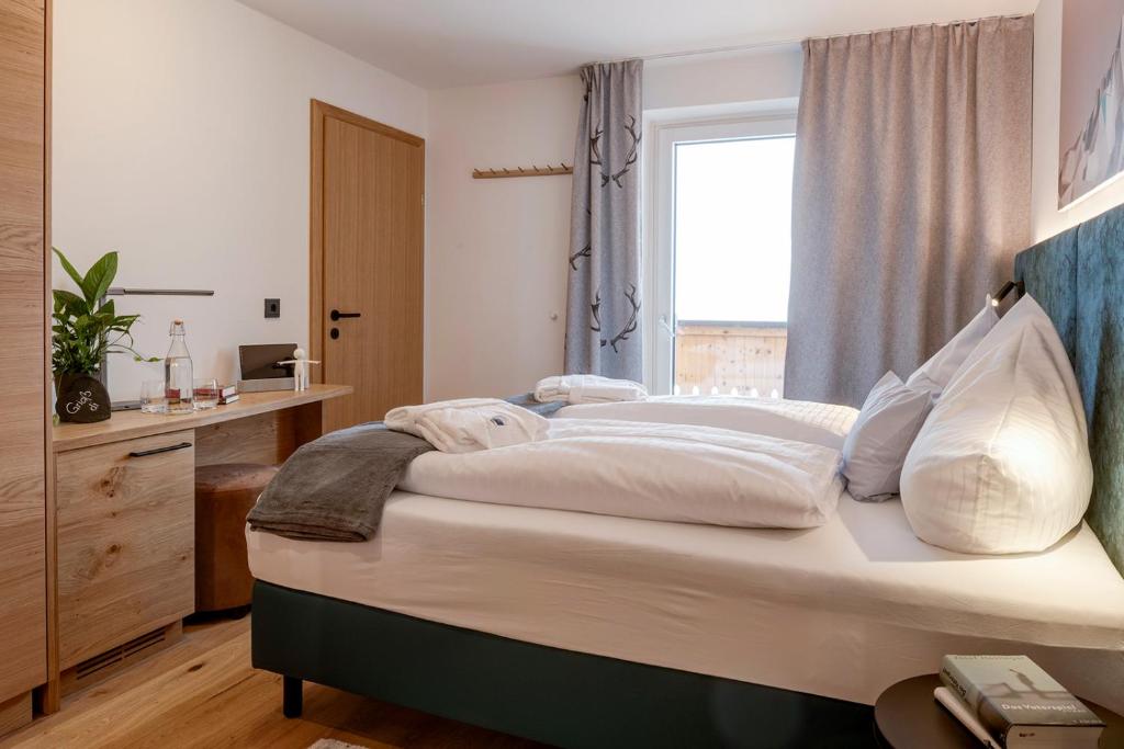Postel nebo postele na pokoji v ubytování Das Unterrain Lifestyle Hotel