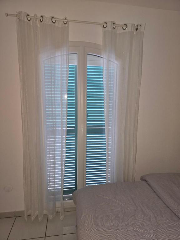 Cama ou camas em um quarto em Villa Perle d&#39;or vue mer