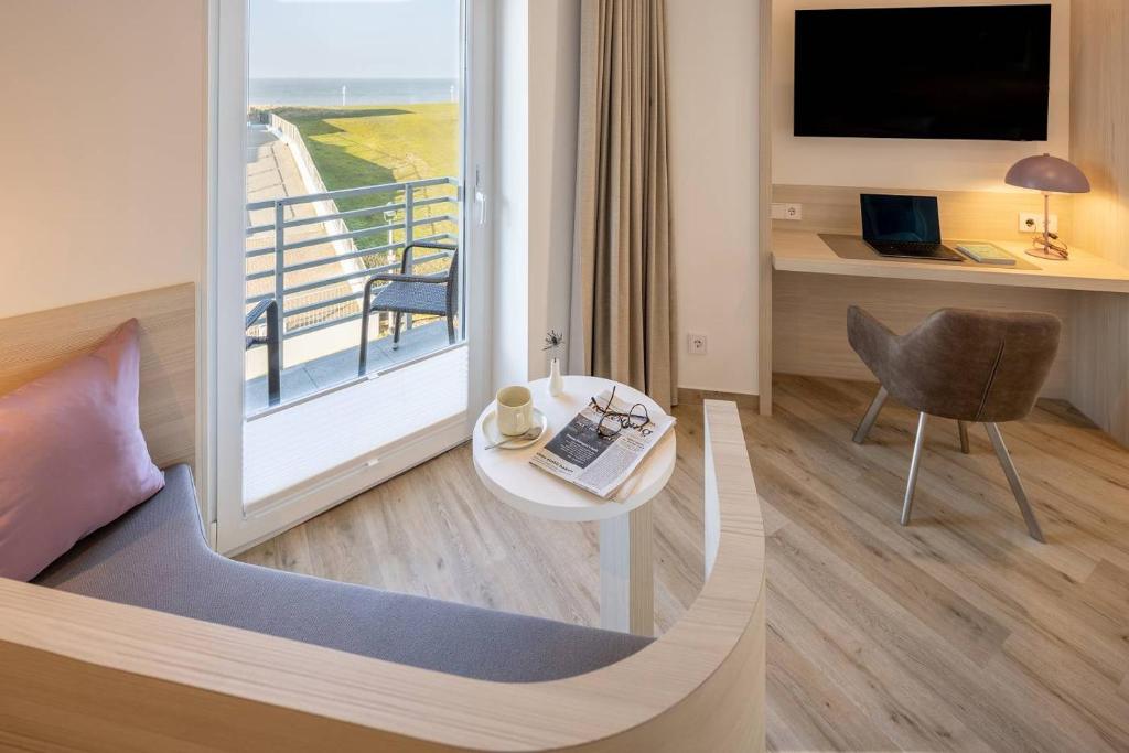 TV a/nebo společenská místnost v ubytování Hotel Stranddistel