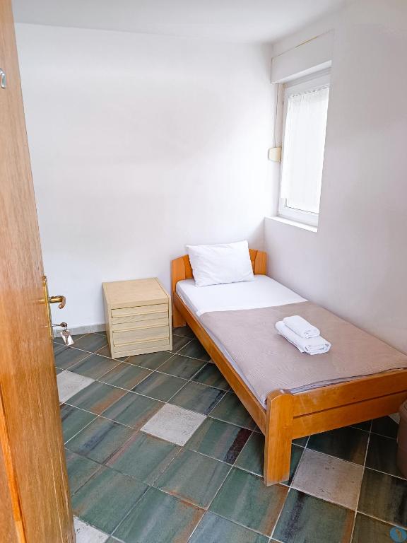 Postel nebo postele na pokoji v ubytování Amisos Apartmani