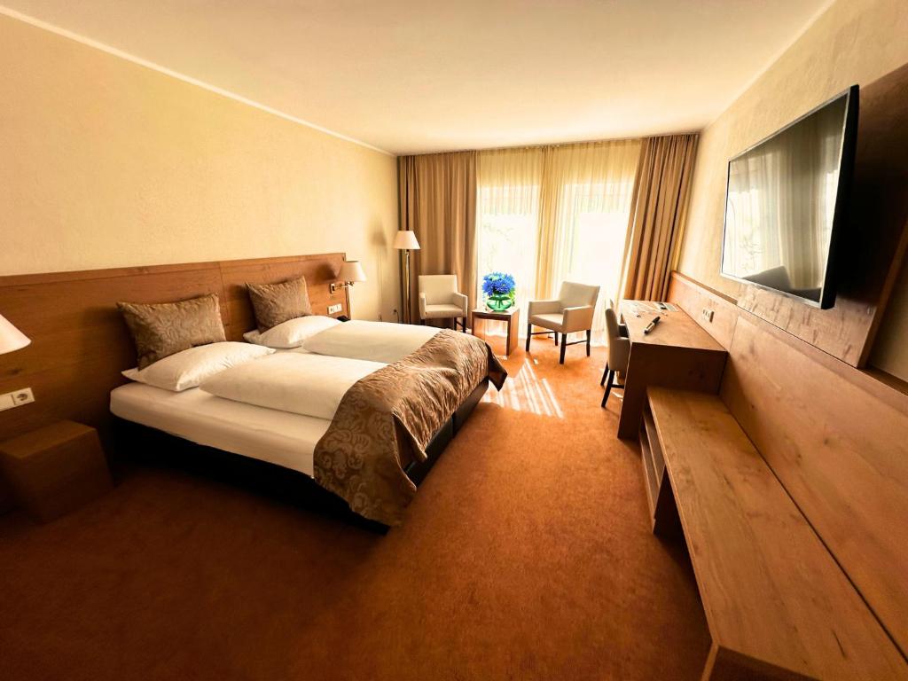 TV a/nebo společenská místnost v ubytování Augustiner Hotel