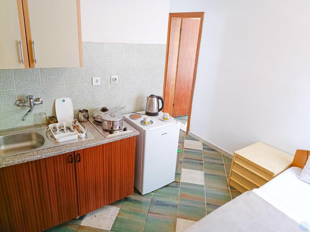 Postel nebo postele na pokoji v ubytování Amisos Apartmani