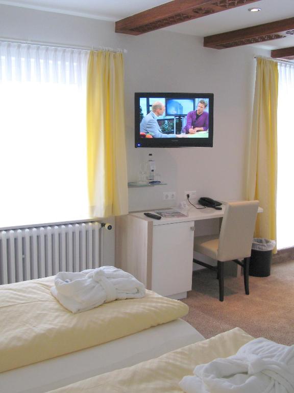 Postel nebo postele na pokoji v ubytování Frühstückshotel Seemannsbraut Amrum-adults only ab 18 Jahre-keine Haustiere-