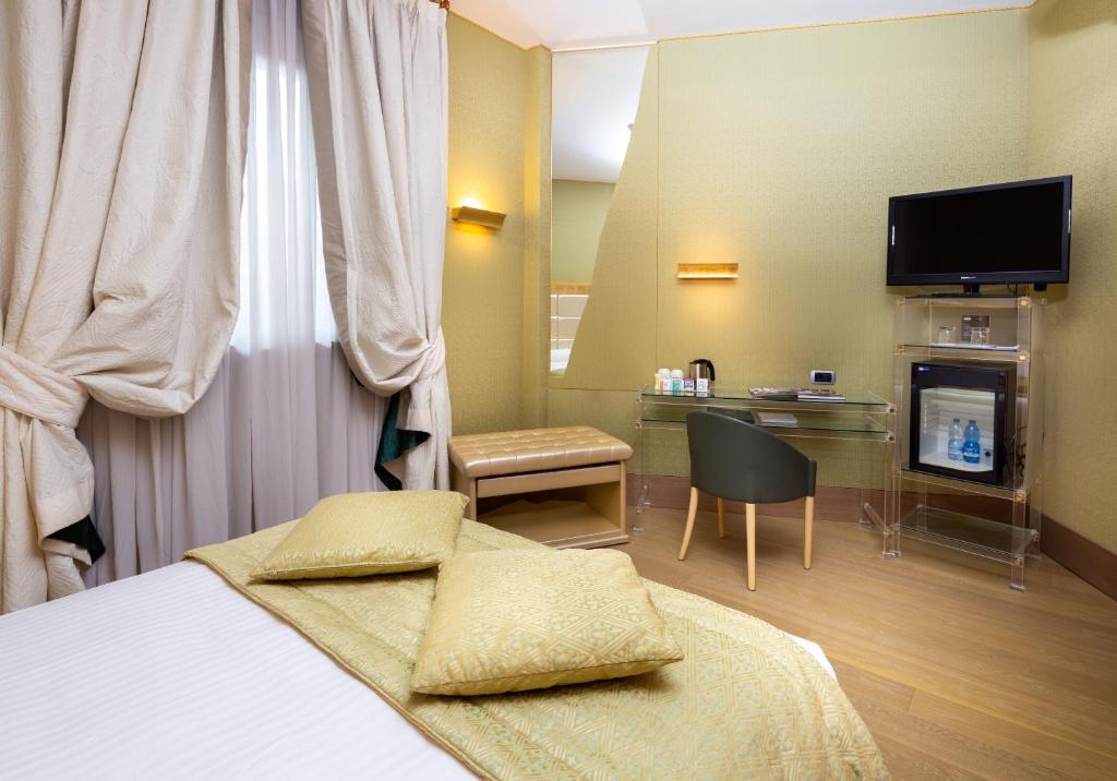 Łóżko lub łóżka w pokoju w obiekcie c-hotels Rubens