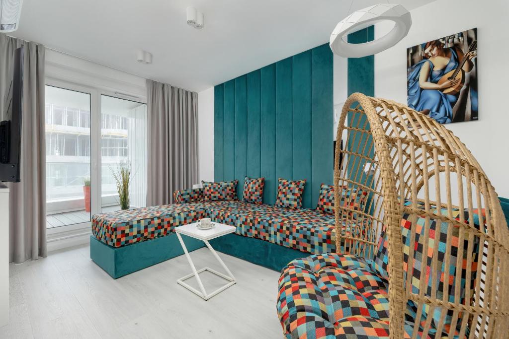 a bedroom with a swing bed and a tv at Rogowo Pearl Turquoise Apartments Near The Sea with FREE PARKING by Renters in Rogowo