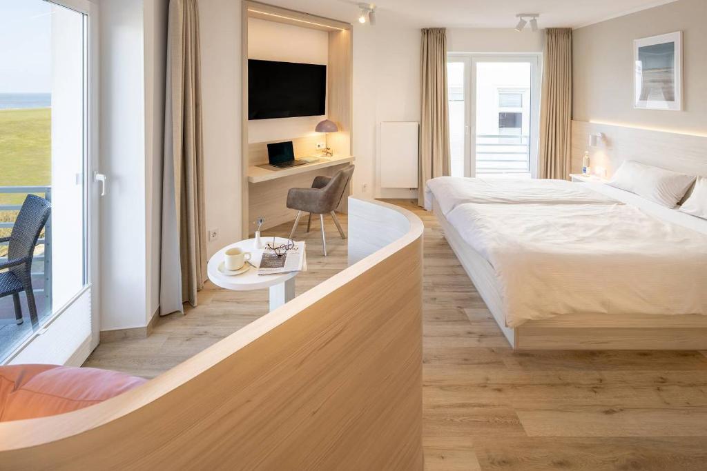 Postel nebo postele na pokoji v ubytování Hotel Stranddistel