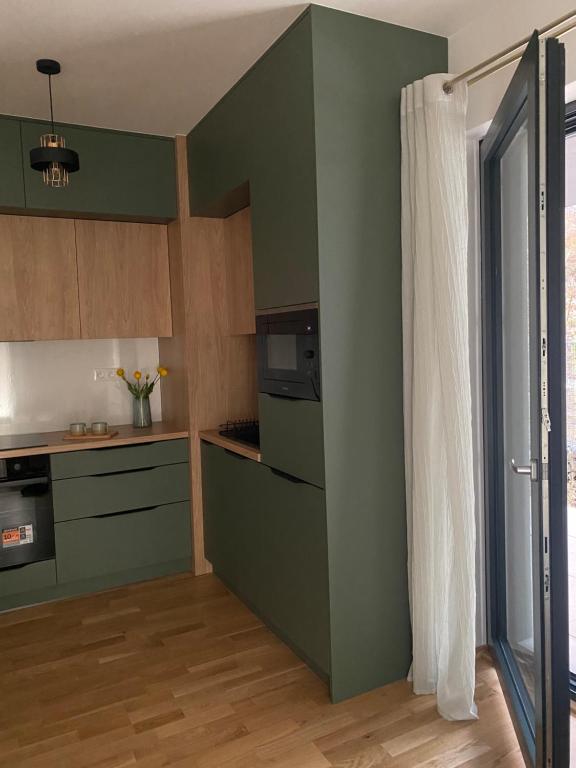 Kuchyň nebo kuchyňský kout v ubytování Apartman s terasou, v novostavbe