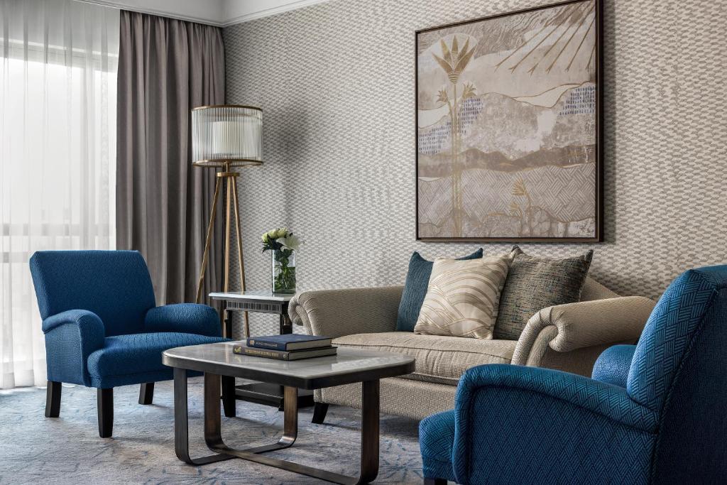 a living room with a couch and two chairs and a table at Intercontinental Cairo Citystars by IHG in Cairo