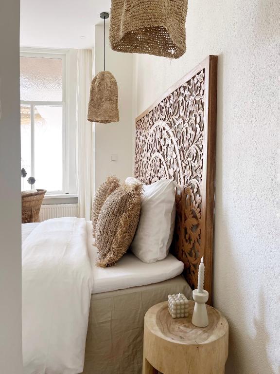 Ein Bett oder Betten in einem Zimmer der Unterkunft Het sfeerhuis aan zee