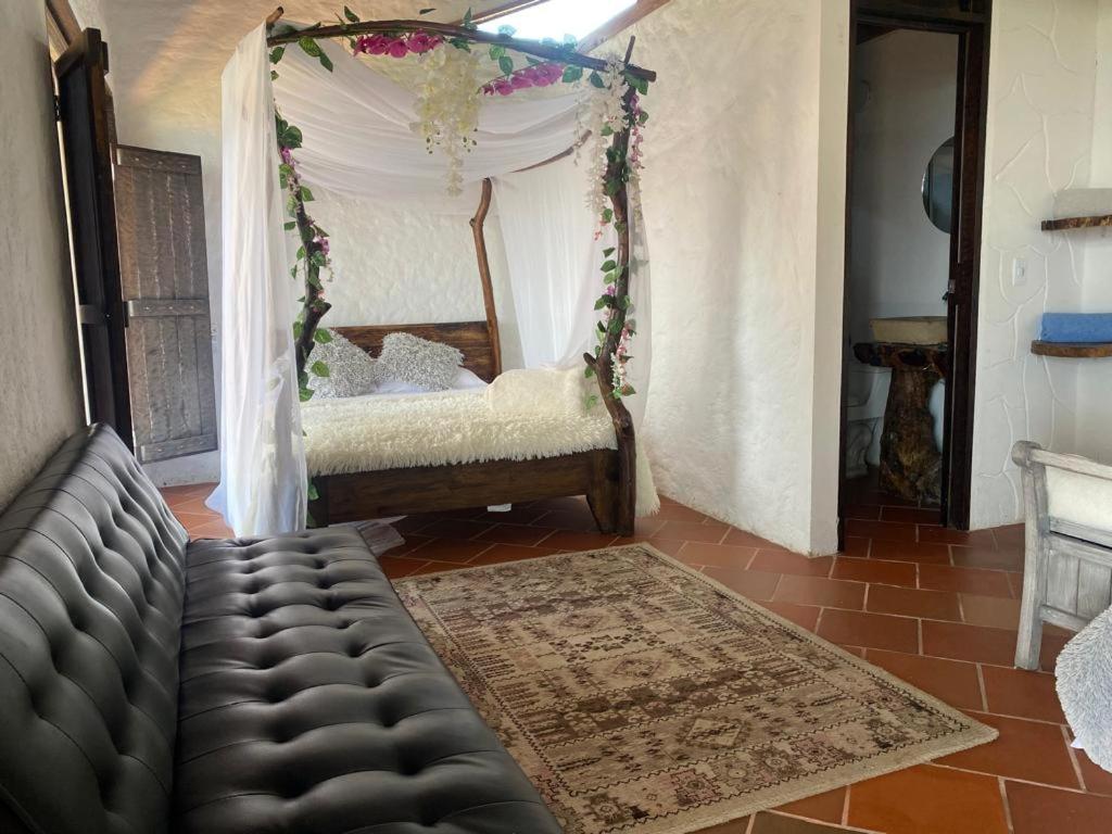 Postel nebo postele na pokoji v ubytování Mirador del Magdalena Hotel y Glamping
