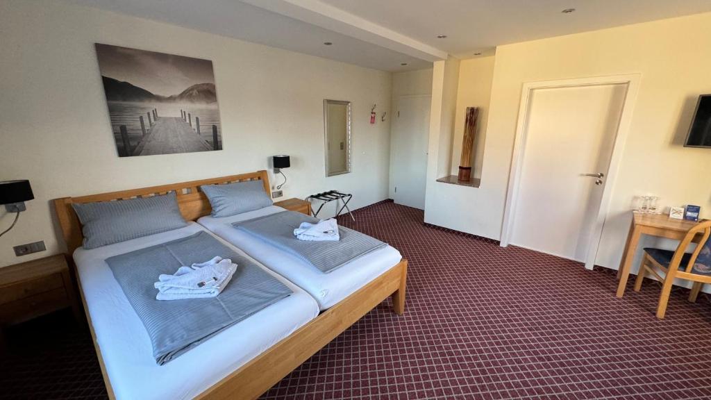 Postel nebo postele na pokoji v ubytování Hotel Leitner