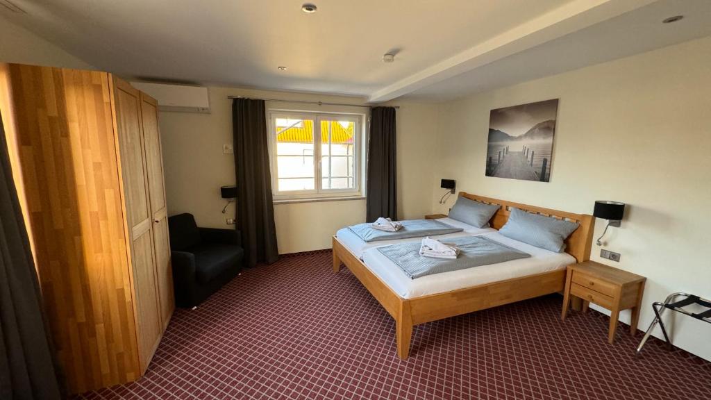 Postel nebo postele na pokoji v ubytování Hotel Leitner