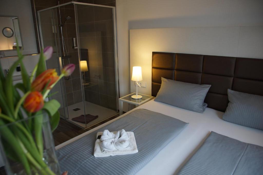 Postel nebo postele na pokoji v ubytování Hotel Leitner