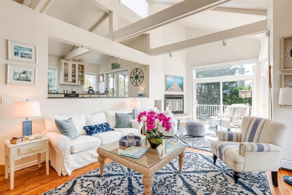 a living room with a white couch and a table at Coastal Cape May Getaway - Steps to Beach! in Cape May