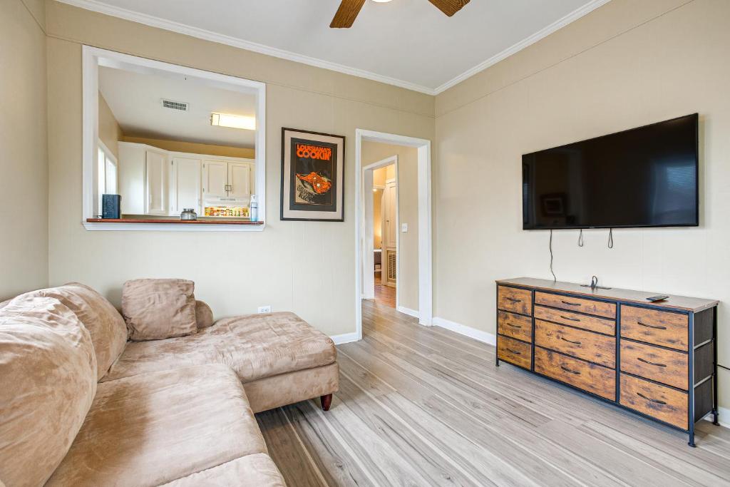 a living room with a couch and a flat screen tv at Hahnville Vacation Rental Near Chemical Plants 