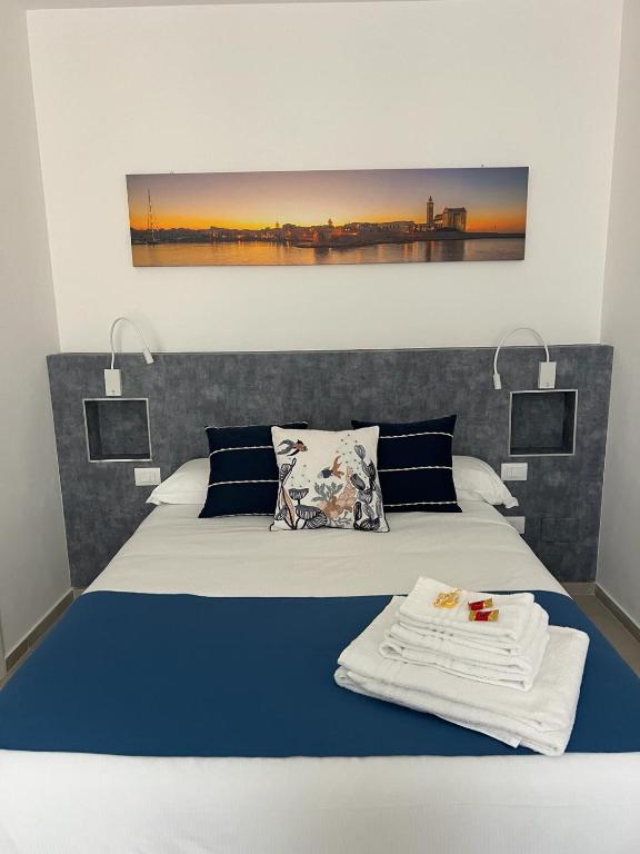 Postel nebo postele na pokoji v ubytování B&B Torre Canina suite & rooms