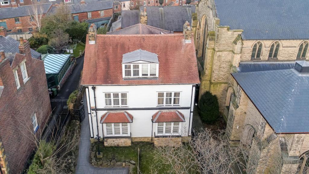 an aerial view of a white house with a red roof at Bannerdale Villa 5 bedroom in Nether Edge