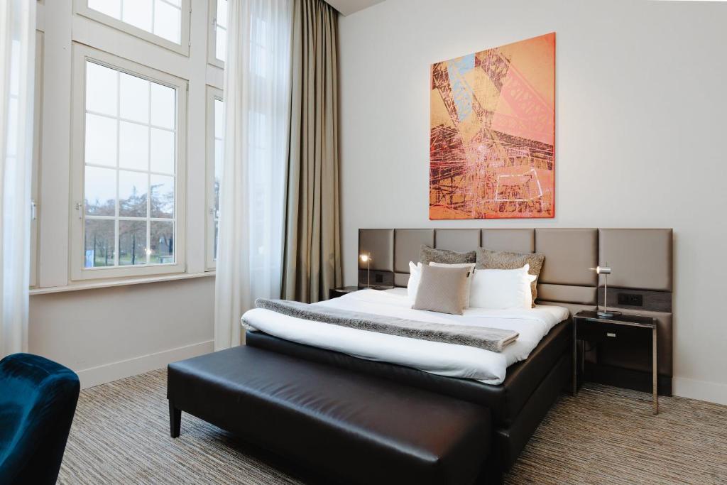 Postel nebo postele na pokoji v ubytování Terhills Hotel