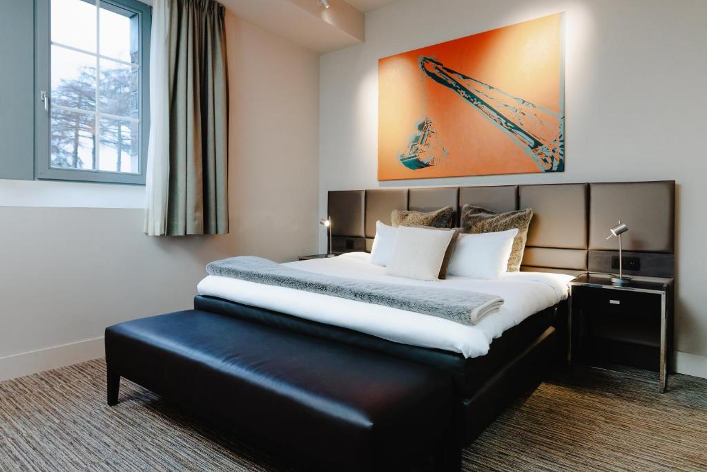 Postel nebo postele na pokoji v ubytování Terhills Hotel