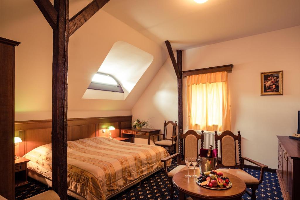 Letto o letti in una camera di Rožmberský dvůr