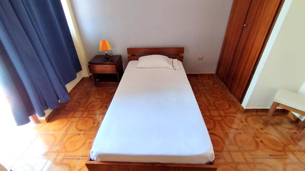 Postel nebo postele na pokoji v ubytování Residencial Amarante