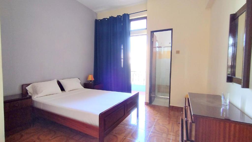 Postel nebo postele na pokoji v ubytování Residencial Amarante